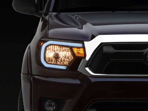 Raxiom 12-15 Toyota Tacoma Axial Series Headlights w  LED Bar- Blk Housing (Clear Lens) on Sale